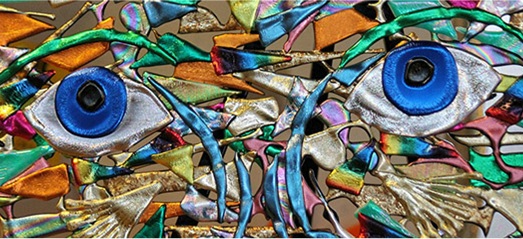 a fabric based artwork with eyes
